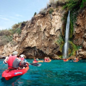 People with life jackets , paddling on a kayak in the sea, in maro Cerro Gordo